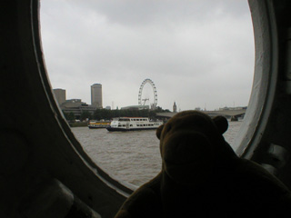 Mr Monkey looking out of a porthole