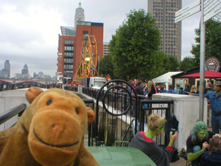 Mr Monkey looking at a distant Ferris Wheel