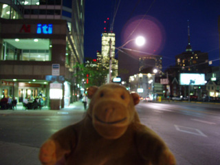 Mr Monkey on a street at night