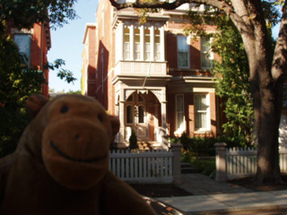 Mr Monkey outside a house on Carlton Street