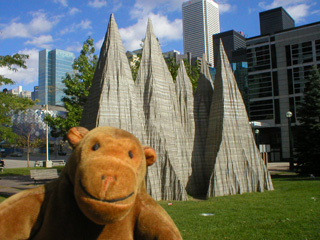 Mr Monkey in front of a sculpted mountain