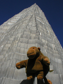 Mr Monkey perched on the side of a sculpted mountain