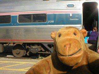 Mr Monkey beside his train