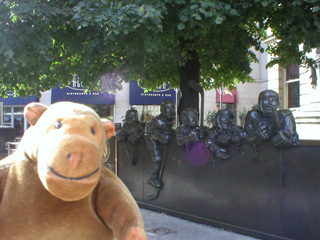 Mr Monkey with the sculptures outside the Hockey Hall of Fame
