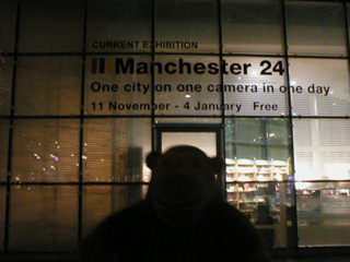 Mr Monkey outside Urbis in the dark