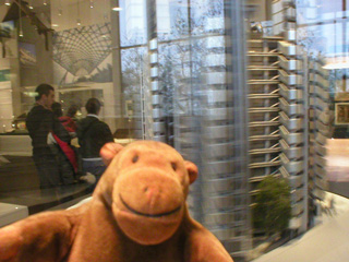 Mr Monkey with a model of a tower block