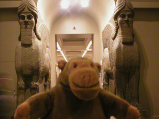 Mr Monkey between a pair of Assyrian winged guardian creatures