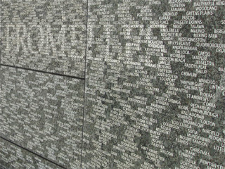 Close up of Australian war memorial, showing place names and the battle honour, Fromelles