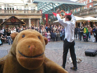 Mr Monkey watching an escapologist successfully escape