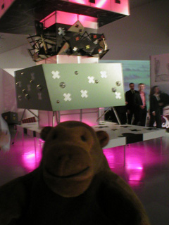 Mr Monkey in front of the model of Stack