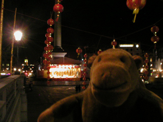 Mr Monkey looking at Chinese decorations in the dark