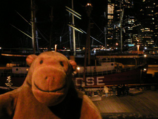 Mr Monkey looking at the Ambrose lightship at night