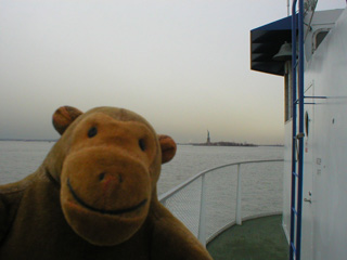 Mr Monkey looking towards Liberty Island from a ferry
