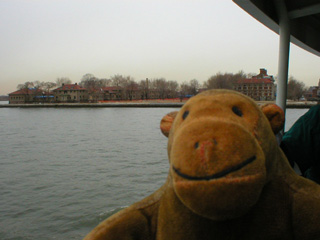 Mr Monkey on a ferry approaching Ellis Island