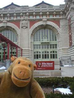 Mr Monkey in front of the main building of Ellis Island