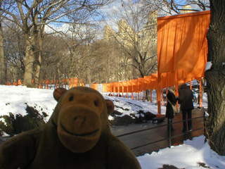 Mr Monkey in front a row of Gates