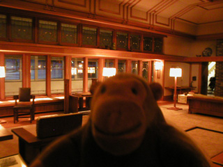 Mr Monkey in a room designed by Frank Lloyd Wright