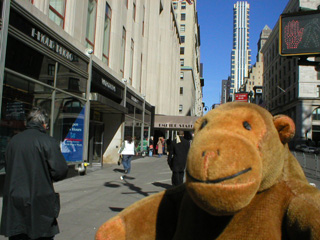 Mr Monkey heading towards the front door of the Empire State Building