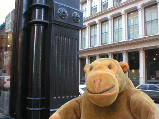 Mr Monkey seeing if a building really is made of cast iron
