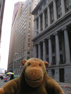 Mr Monkey looking south on Wall Street
