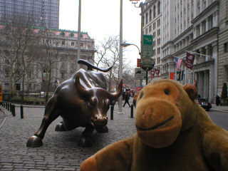 Mr Monkey in front of the the Wall Street bull