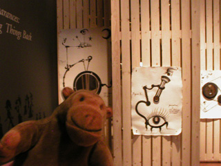 Mr Monkey looking choosing a peephole to look through