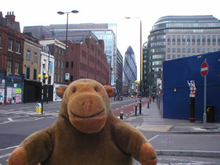 Mr Monkey looking toward the Swiss Re tower