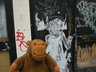 Mr Monkey looking at a Swoon cutout