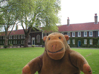 Mr Monkey looking towards the main range of the almshouses