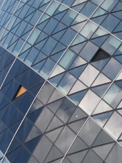 Close up of the Swiss Re tower, showing missing window panes