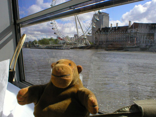 Mr Monkey looking towards the London Eye from Westminster Pier