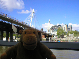 Mr Monkey going under the Jubilee footbridges