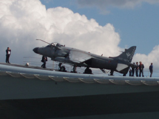An aircraft stopped on the end of HMS Illustrious' flight deck