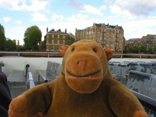 Mr Monkey passing Oliver's Wharf and Wapping pierhead