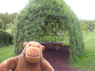 Mr Monkey outside a Willow Cabin of sonnets