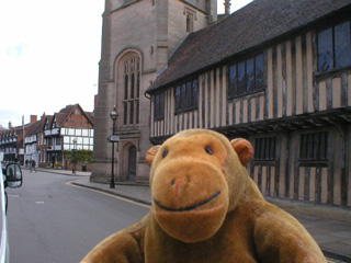 Mr Monkey outside the Guild chapel and grammar school