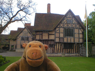 Mr Monkey looking at the side of Hall's Croft