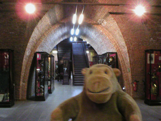 Mr Monkey in a large brick vaulted chamber