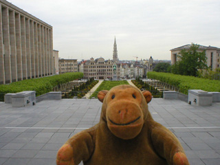 Mr Monkey walking towards a crowd of people