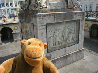 Mr Monkey looking down at the sides of the monument