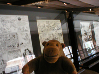 Mr Monkey looking at comic strips