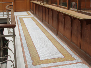 The mosiac floor in front of the top floor offices