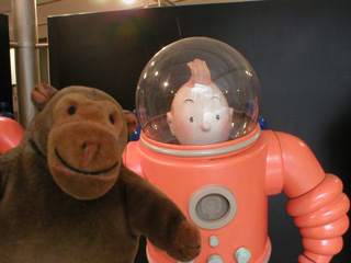 Mr Monkey posing with Tintin in his spacesuit