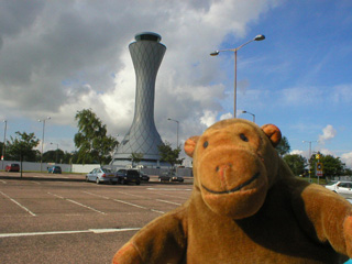 Mr Monkey looking at the Edinburgh airport control tower
