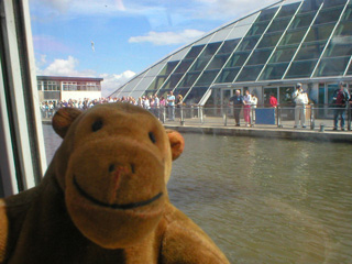 Mr Monkey approaching the Visitor Centre by boat