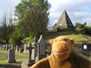 Mr Monkey looking at the Star Pyramid in Holy Rude churchyard