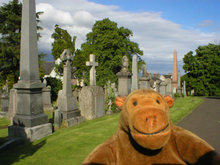 Mr Monkey looking at monuments in Holy Rude churchyard