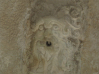 A grotesque carved face