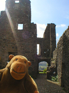 Mr Monkey looking at the kitchen and stairs of the hall range