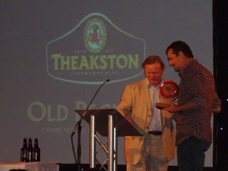 Mr Billingham receiving his trophy from Mr Theakston